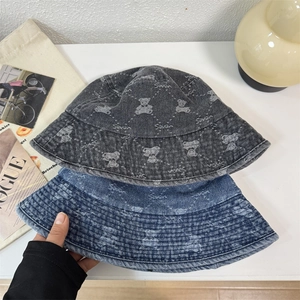 Vintage washed denim bucket hat with jacquard bear patterns in charcoal and indigo