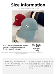 Detailed embroidery of a cute bear on cotton baseball caps in various vibrant colors