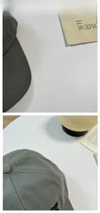 Detail of dark grey twill cotton baseball cap brim with precise multi-row stitching