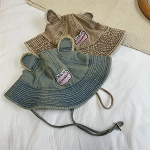 Vintage denim bucket hats with bear ears in brown and blue colors with frayed edges