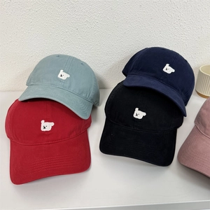Collection of colorful cotton baseball caps with cute bear embroidery in various shades