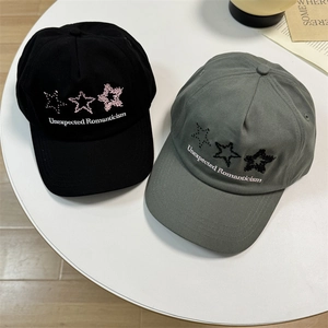 Classic cotton baseball caps in black and sage green with star embroidery and text