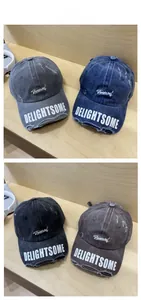 Detailed tile display of four vintage distressed baseball caps with frayed brim and embroidery
