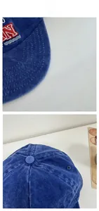 Detail view of deep blue washed cotton baseball cap with red and white embroidered letters