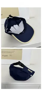Macro view of blue five-panel cap featuring yellow embroidery and adjustable buckle