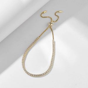 Detail of gold adjustable tennis bracelet with sparkling 2mm round cubic zirconia stones