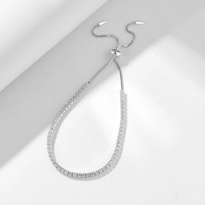 Detail view of 2mm zircon tennis bracelet with adjustable sliding buckle in silver finish