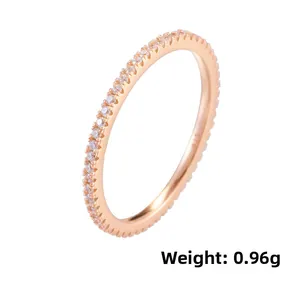Close-up of S925 hallmark on a thin rose gold ring with micro-pave cubic zirconia