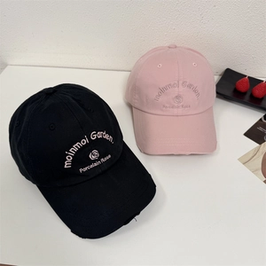 Distressed cotton baseball caps with rose embroidery in black and pink colors