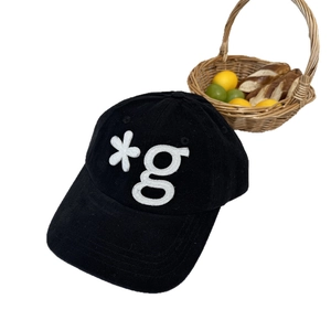 Classic black corduroy baseball cap with white letter embroidery and retro texture