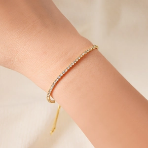 Adjustable S925 silver tennis bracelet with 2mm round zircons on model wrist