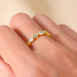 Macro shot of 925 silver gold-plated ring with marquise and round zircon stones