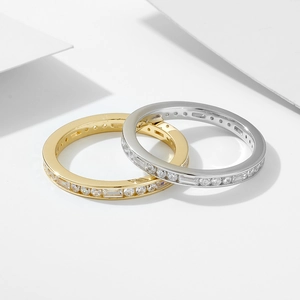 Minimalist silver and gold stackable eternity rings with clear cubic zirconia crystals