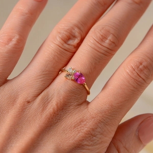 Elegance gold-plated ring featuring pear-cut pink zircon and side accent white stones