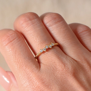 Micro zircon gold ring for women featuring five round center stones and pavé accents