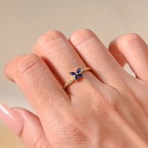 Elegant gold butterfly ring with navy marquise stones and pave diamonds for women