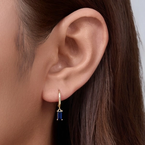 Elegant 925 silver gold hoop earrings with rectangular blue zircon drop on model