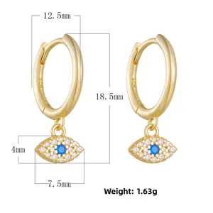 Detailed view of S925 sterling silver evil eye earrings with blue zircon in gold finish