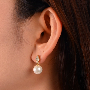 Elegant S925 silver four-leaf clover pearl earrings with micro-set zircon accents