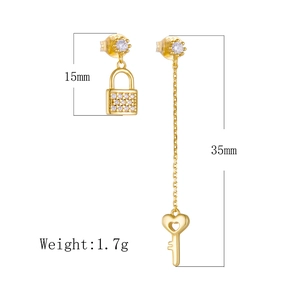 Detailed size view of asymmetric S925 silver key and lock tassel earrings with zircon