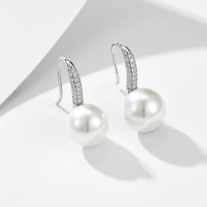 Detailed close-up of S925 silver pearl drop earrings with micro-set zircon accents
