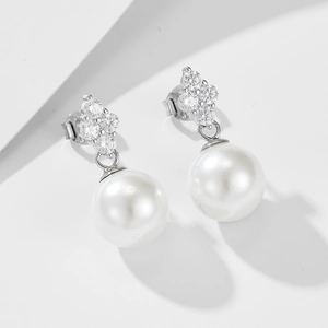 S925 silver clover pearl earrings featuring zircon clusters on a minimalist background