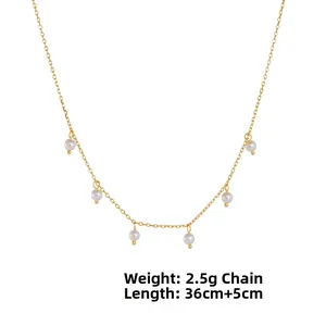 Detail of elegant gold link chain with six lustrous pearls, 36cm length and 2.5g weight