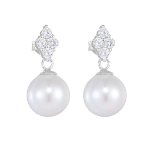 Macro shot of S925 silver four-leaf clover earrings with zircon crystals and round pearls