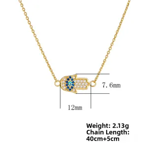 Détails du collier Main de Fatma avec pendentif œil bleu et chaîne dorée