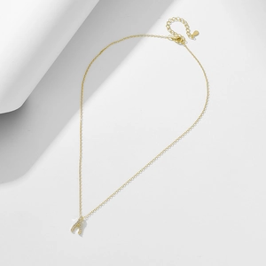 Detailed view of the gold wishbone pendant with pavé cubic zirconia and lobster clasp chain