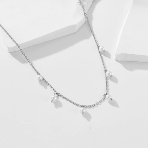 Elegant vintage sterling silver necklace with delicate shell pearls on a minimalist chain
