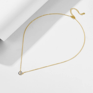Detailed close-up of S925 sterling silver hallmark on gold evil eye pendant necklace