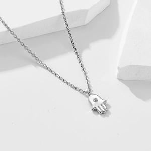 S925 sterling silver Hamsa hand necklace with sparkling cubic zirconia on white background