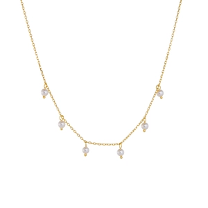Elegant gold chain necklace with six dangling white round pearls on white background
