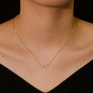 Sterling silver gold necklace with three opal and diamond pendants on a neck