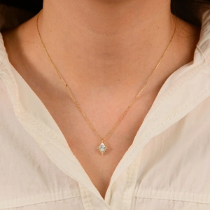 925 silver geometric diamond pendant necklace with gold finish on a female model