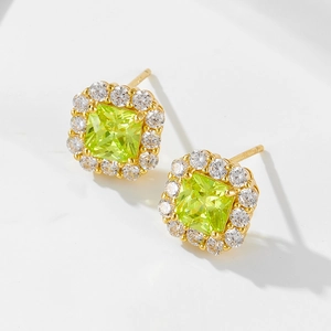 Macro view of square yellow gemstone halo earrings with sparkling zircon inlay
