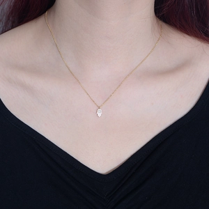 925 silver gold Hamsa Hand necklace with white opal and cubic zirconia on a model