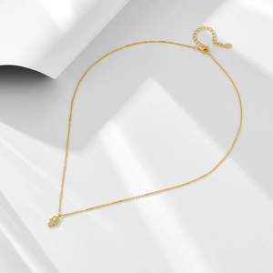 Detail showing the S925 sterling silver hallmark on a gold Hamsa opal necklace