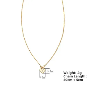 Detail of gold heart pendant 5.3x6.6mm with zircon and 40+5cm delicate cross chain