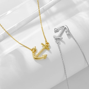 Fashionable anchor pendant necklace in gold and silver finish with cross chain