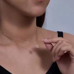 Detailed close-up of S925 sterling silver necklace with champagne square zircon pendant