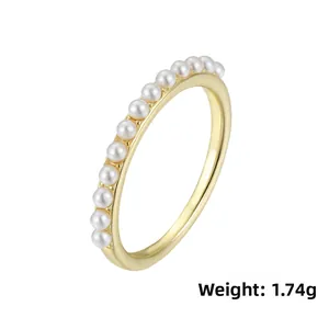 Detailed view of s925 silver pearl ring weighing 1.74g with golden finish and rows of gems
