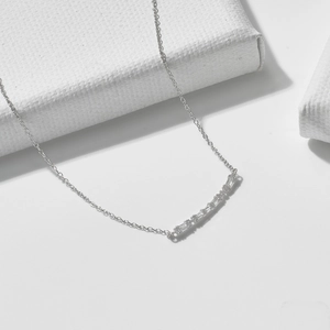 Elegant S925 sterling silver necklace featuring a baguette cut zircon smile pendant