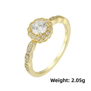 Macro shot of gold floral ring featuring S925 hallmark and micro-pave cubic zirconia