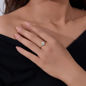 Detailed view of s925 silver ring with halo set zircon and round white gemstone center