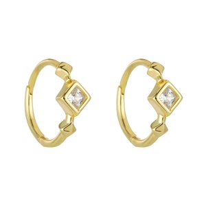 Detail of gold-plated huggie earrings with square-cut cubic zirconia in bezel setting