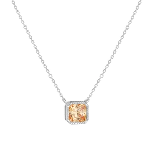 Macro shot of silver necklace with square champagne zircon pendant in four-prong setting