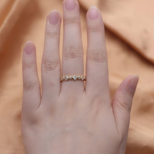 Detail of geometric silver ring with full circle zircon and 18K gold plating on fingers
