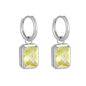 Macro shot of 925 sterling silver stamp and emerald cut yellow zircon on hoop earrings